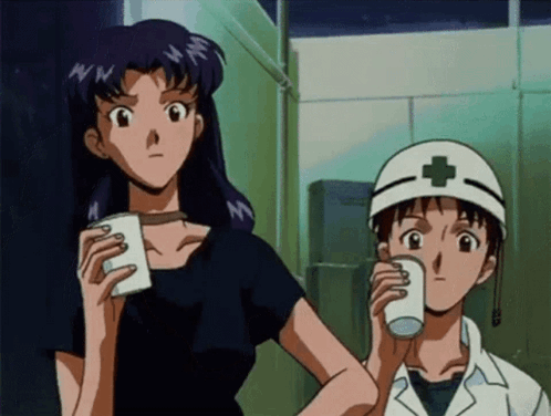 A Man Wearing A White Helmet With A Cross On It Drinks From A White Cup GIF