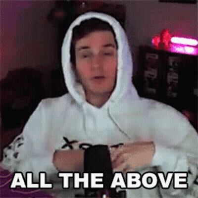 A Man Wearing A White Hoodie Is Sitting In Front Of A Microphone And Says `` All The Above '' . GIF