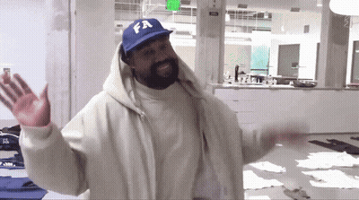 A Man Wearing A White Jacket And A Blue Hat With Fa On It GIF