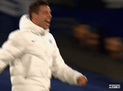 A Man Wearing A White Jacket With The Word Heiitse On It GIF