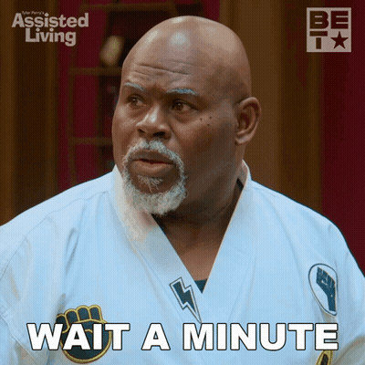 A Man Wearing A White Karate Uniform Says Wait A Minute GIF