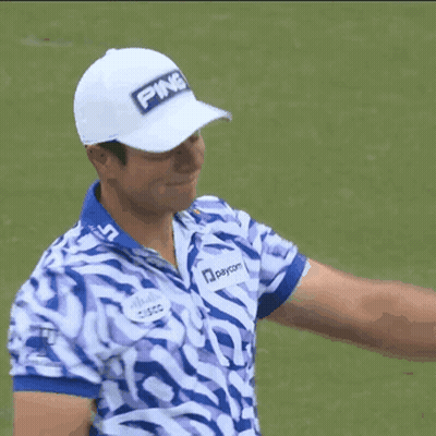 A Man Wearing A White Ping Hat And A Blue And White Striped Shirt GIF