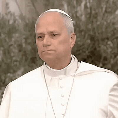 A Man Wearing A White Robe And A White Hat Looks Serious GIF