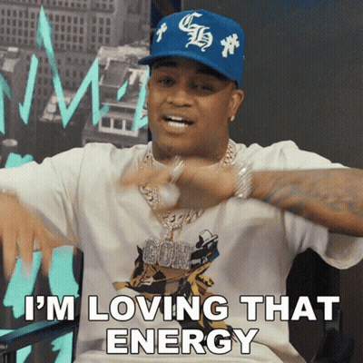 A Man Wearing A White Shirt And A Blue Hat Is Saying I 'M Loving That Energy GIF