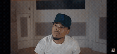 A Man Wearing A White Shirt And A Hat With The Number 3 On It GIF