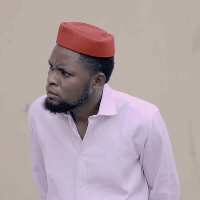 A Man Wearing A White Shirt And A Red Hat Is Asking How Much GIF