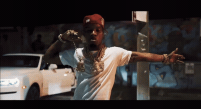 A Man Wearing A White Shirt And A Red Hat With The Letter G On It GIF