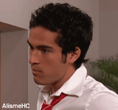 A Man Wearing A White Shirt And A Red Tie Is Standing In Front Of A Sign That Says Alishmehc GIF