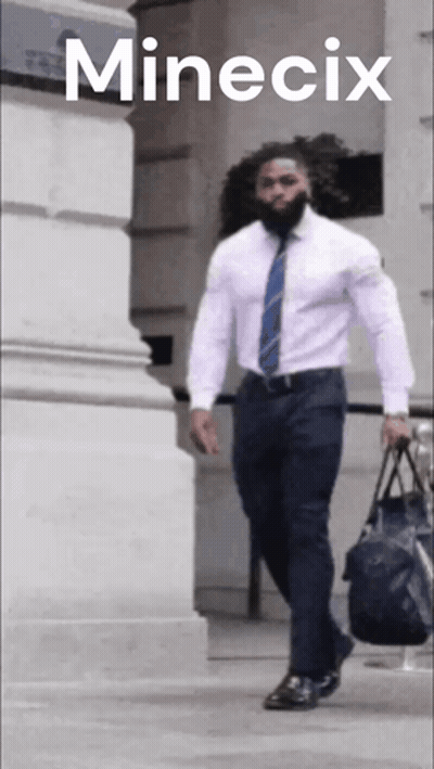 A Man Wearing A White Shirt And Blue Tie Is Carrying A Bag And The Word Minecix Is On The Bottom GIF
