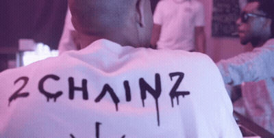 A Man Wearing A White Shirt That Says 2 Chainz GIF
