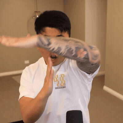 A Man Wearing A White Shirt That Says 40Th Anniversary On It GIF