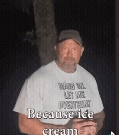 A Man Wearing A White Shirt That Says `` Hang On , Let Me Overthink Because Ice Cream '' GIF