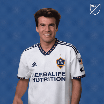 A Man Wearing A White Shirt That Says Herbalife Nutrition GIF