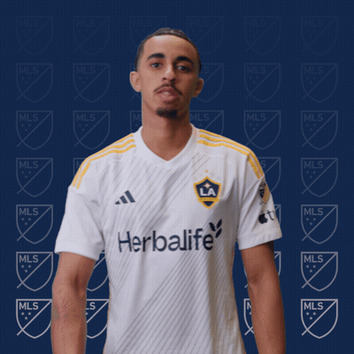 A Man Wearing A White Shirt That Says Herbalife On It GIF