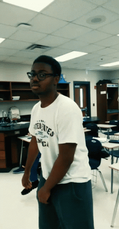 A Man Wearing A White Shirt That Says United States Of America GIF