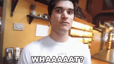 A Man Wearing A White Shirt That Says Whaaaaat GIF