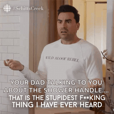 A Man Wearing A White Shirt That Says Wild Aloof Rebel On It GIF