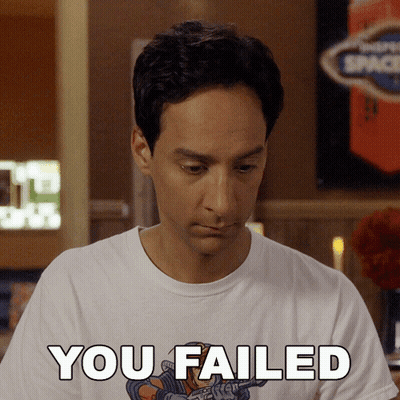 A Man Wearing A White Shirt That Says " You Failed " GIF