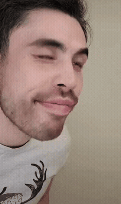 A Man Wearing A White Shirt With A Deer On It GIF