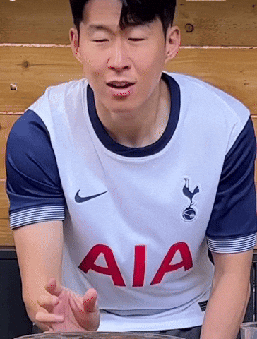 A Man Wearing A White Shirt With Aia On The Front GIF