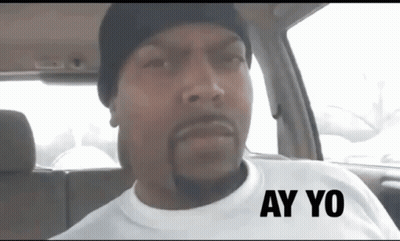 A Man Wearing A White Shirt With Ay Yo Written On It GIF