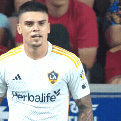 A Man Wearing A White Shirt With The Word Herbalife On The Front GIF