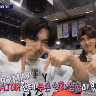 A Man Wearing A White Shirt With The Word Major On It Is Making A Face GIF
