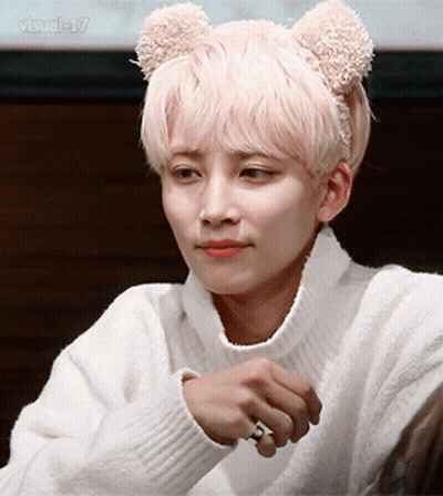 A Man Wearing A White Sweater And A Teddy Bear Headband GIF