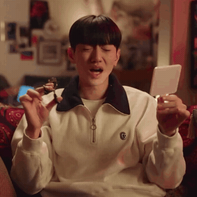 A Man Wearing A White Sweater With The Letter C On It GIF
