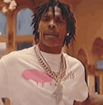 A Man Wearing A White T-Shirt And A Gold Chain Around His Neck . GIF