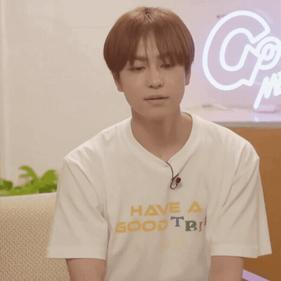 A Man Wearing A White T-Shirt That Says Have A Good Trip GIF