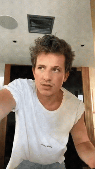 A Man Wearing A White T-Shirt That Says ' I Love You ' On It GIF