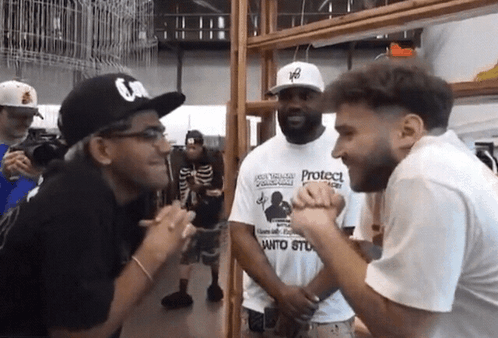 A Man Wearing A White T-Shirt That Says Protect On It GIF