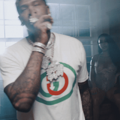 A Man Wearing A White T-Shirt With A G On It GIF