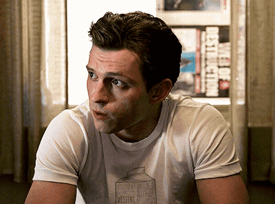 A Man Wearing A White T-Shirt With A Milk Carton On It GIF
