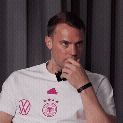A Man Wearing A White T-Shirt With A Volkswagen Logo On It GIF