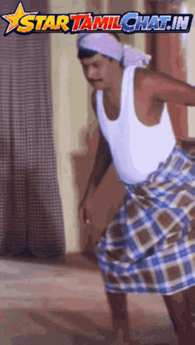 A Man Wearing A White Tank Top And A Plaid Skirt Is Dancing In Front Of A Star Tamilchat.in Logo GIF