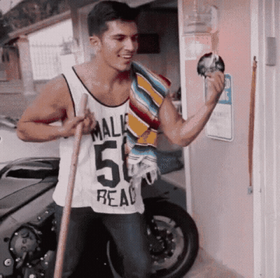 A Man Wearing A White Tank Top That Says Mali 50 Real GIF