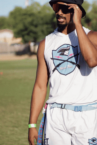 A Man Wearing A White Tank Top That Says Miami Hawks GIF