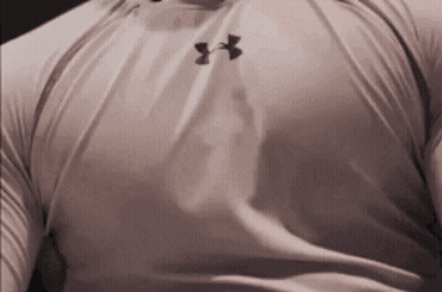 A Man Wearing A White Under Armour Shirt With Black Letters GIF