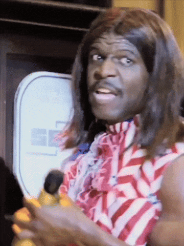 A Man Wearing A Wig And A Red White And Blue Striped Shirt Is Holding A Banana GIF
