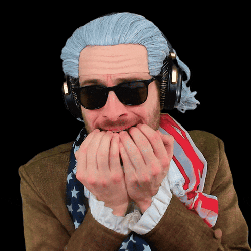A Man Wearing A Wig And Headphones Holds His Hands To His Mouth GIF