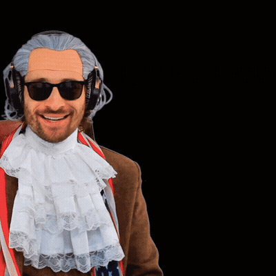 A Man Wearing A Wig And Headphones Is Giving A Peace Sign GIF