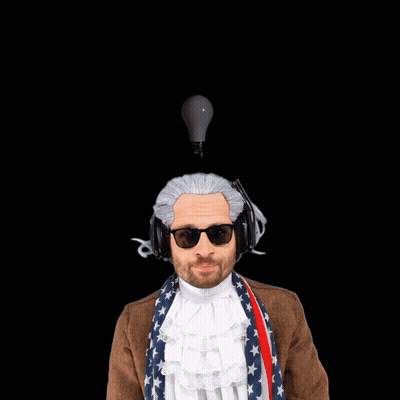 A Man Wearing A Wig And Headphones Points At The Camera With The Words That 'S A Good Idea Behind Him GIF