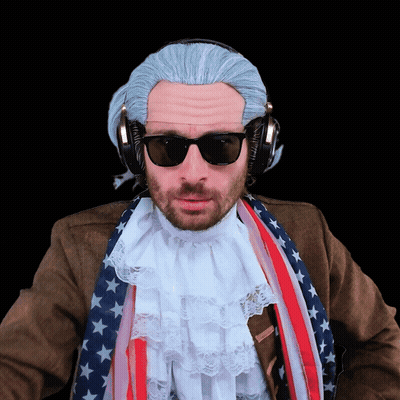 A Man Wearing A Wig And Sunglasses Has Headphones On GIF