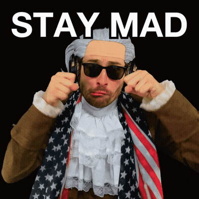A Man Wearing A Wig And Sunglasses Has The Words Stay Mad Written Above Him GIF