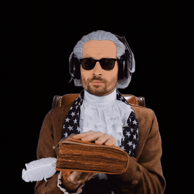 A Man Wearing A Wig And Sunglasses Is Holding A Book And A Feather GIF