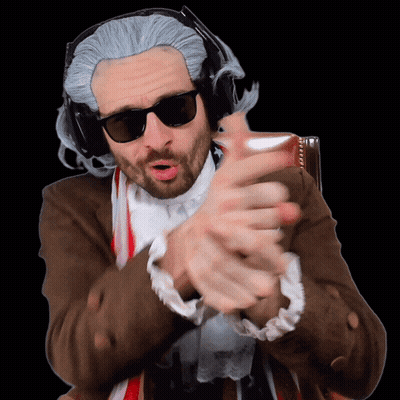 A Man Wearing A Wig And Sunglasses Is Making A Gesture With His Hands GIF