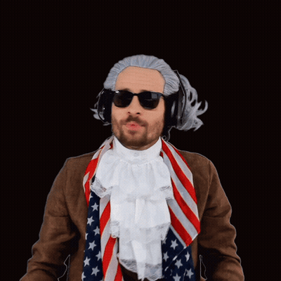 A Man Wearing A Wig And Sunglasses Is Singing " Praise The Lord " GIF