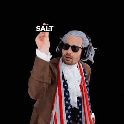 A Man Wearing A Wig And Sunglasses Pointing At The Camera With The Words Salt Behind Him GIF